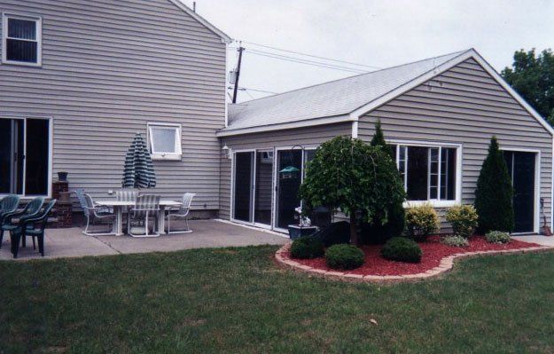 Sliding Patio Doors installed in a grey vinyl sided home Grand Island, NY
