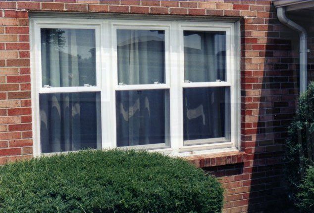 Triple sliding windows installed in a brick home Tonawanda, NY