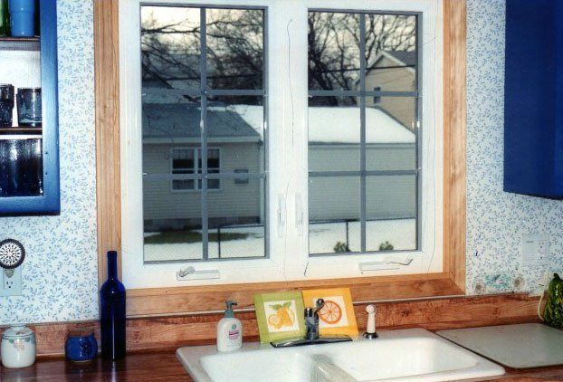 double panels windows set above a white sink Kenmore, NY