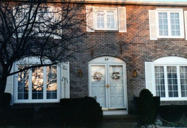 Brick house with new sliding windows