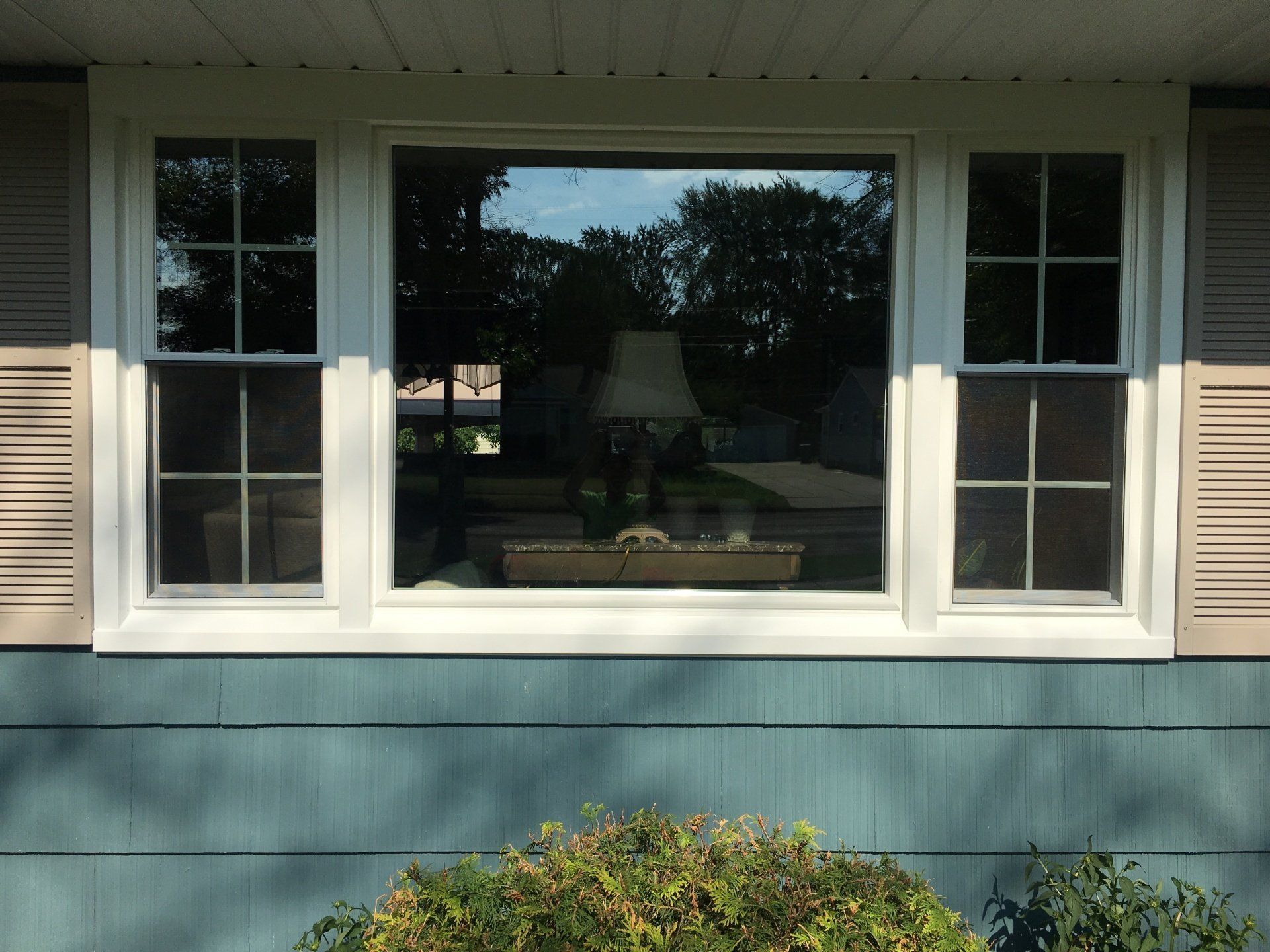 split window on teal house