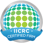 IICRC Certified Firm logo: a silver-bordered circle containing a blue and green dotted globe with a blue ribbon banner.