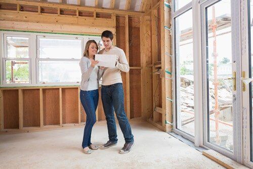 Couple Looking at Plan — New Construction in Miles City, MT