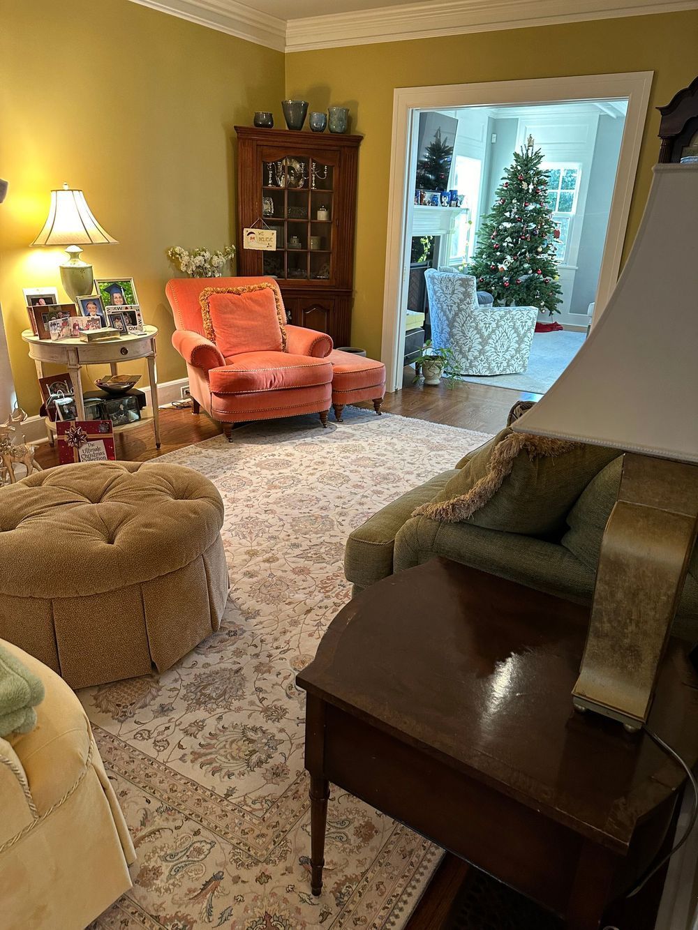A living room filled with furniture and a christmas tree.