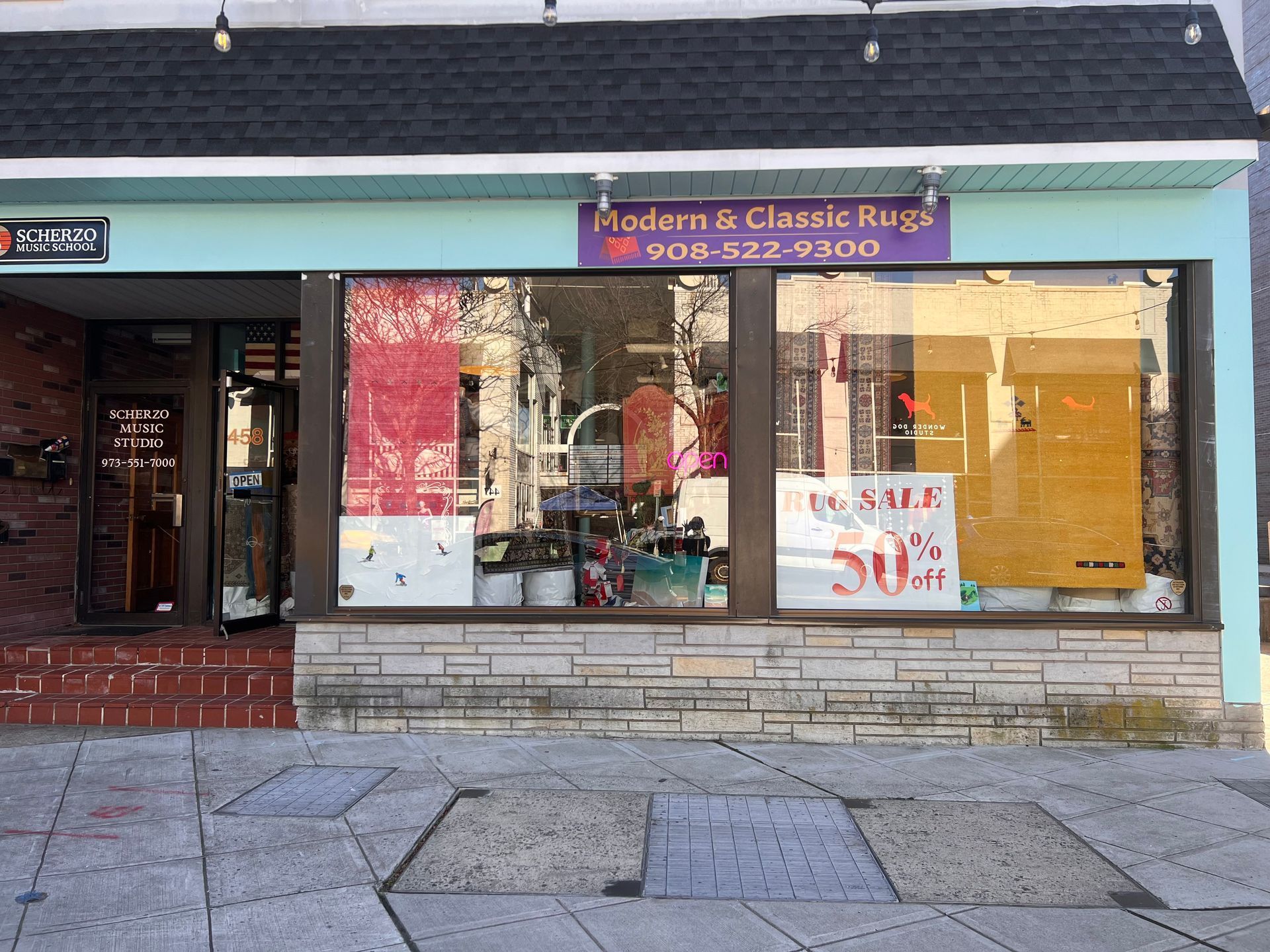 A store front with a sign that says adam & classic rings