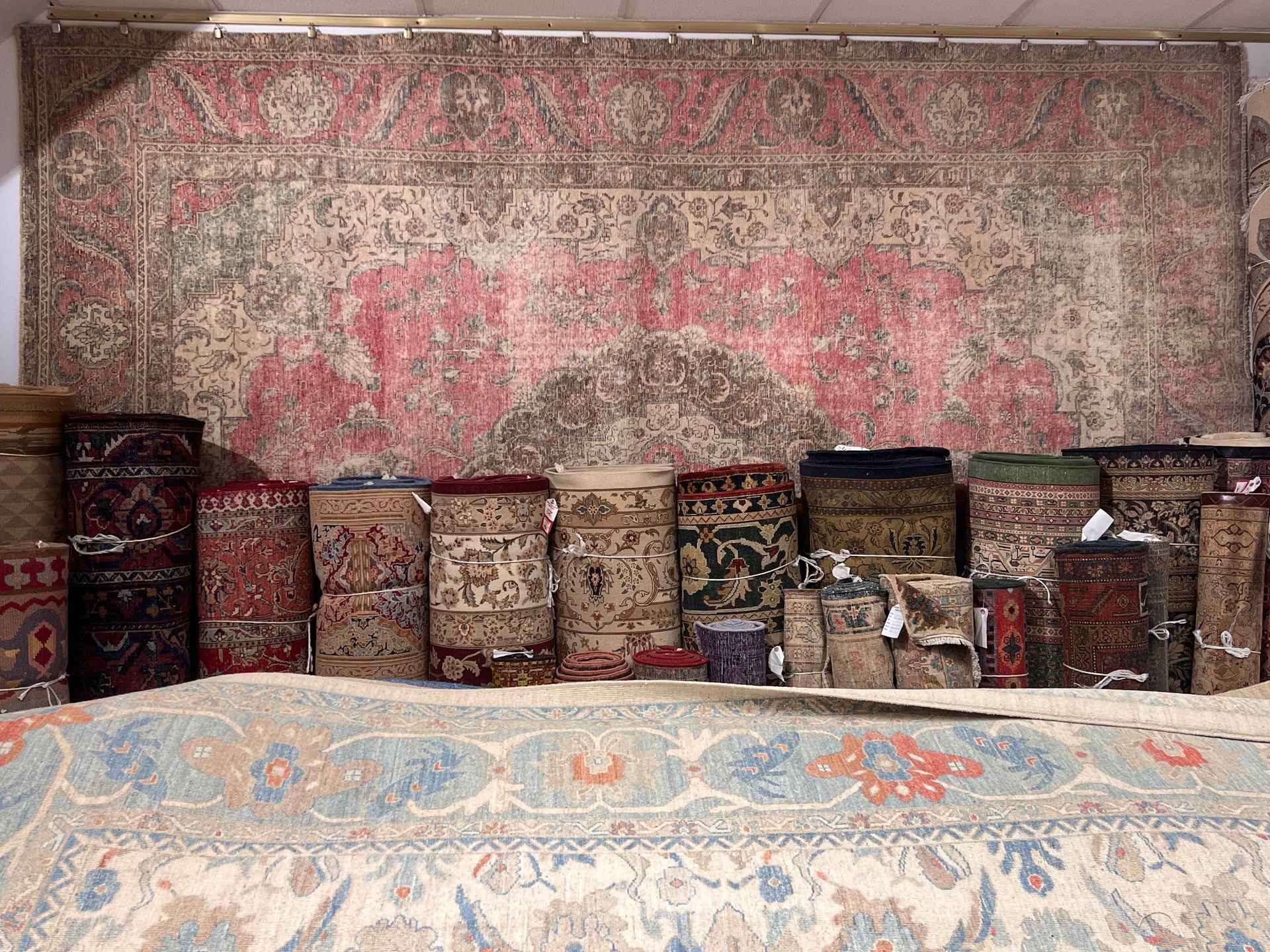 A room filled with lots of rugs and pillows.