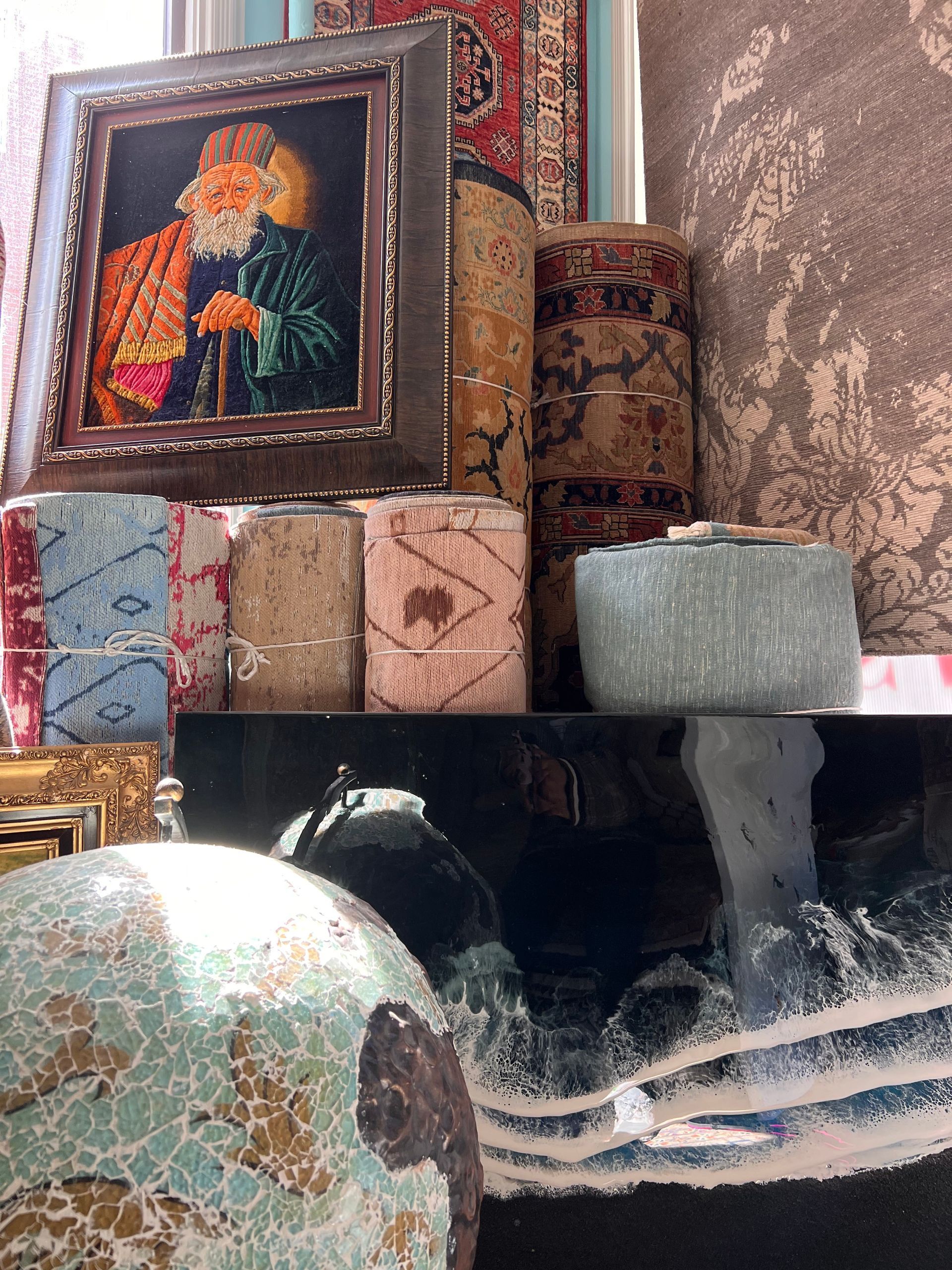 A table with a globe and a painting on it