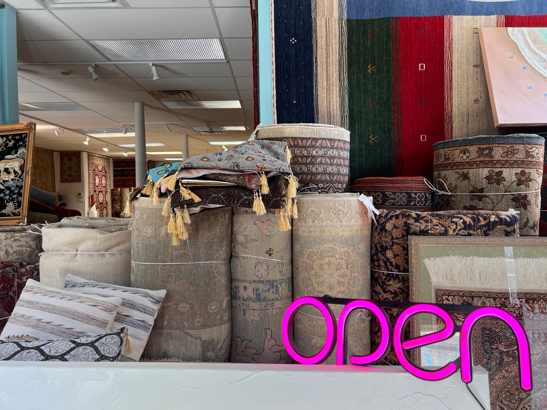 A store front with a sign that says open on it