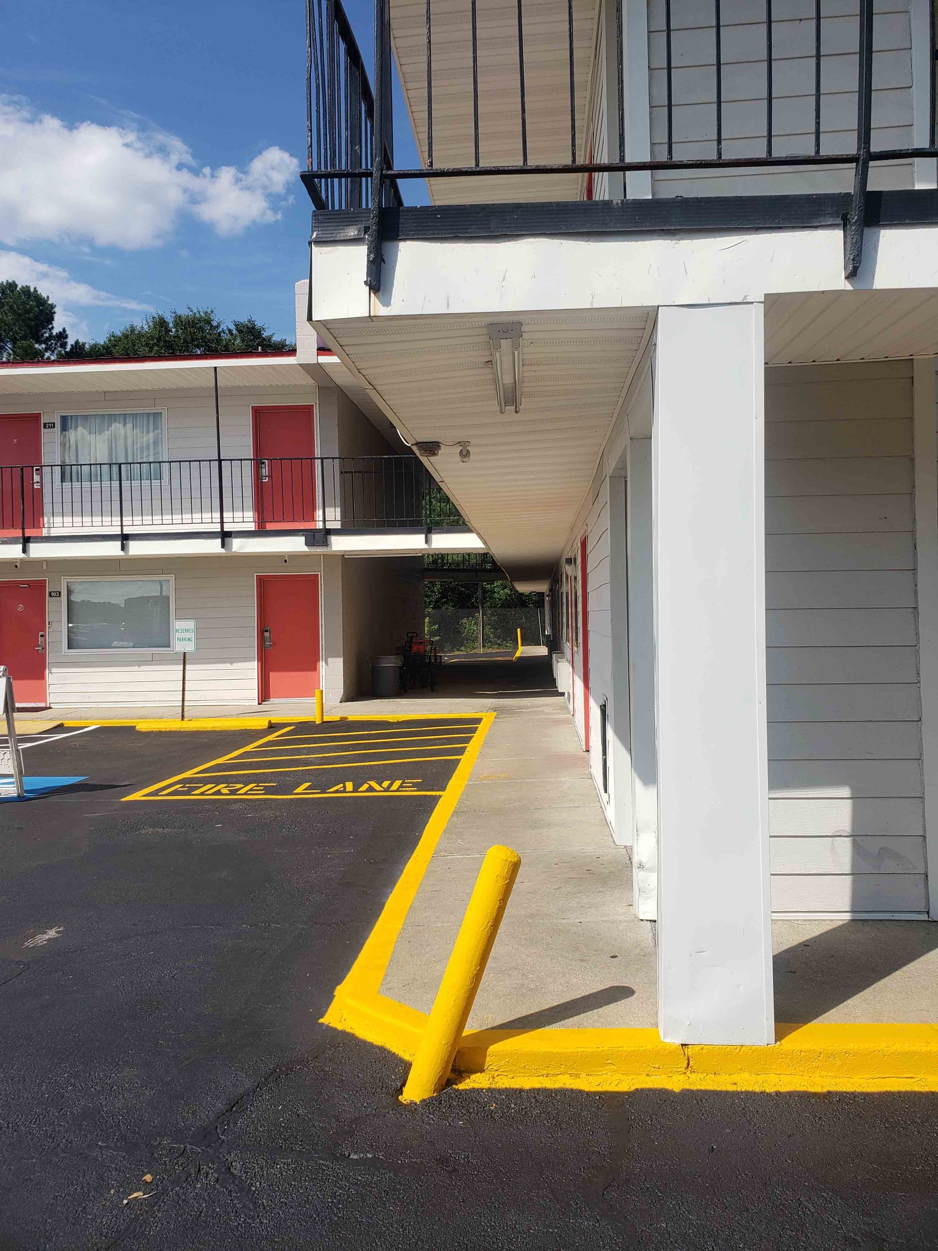 A motel with a handicapped parking spot in front of it