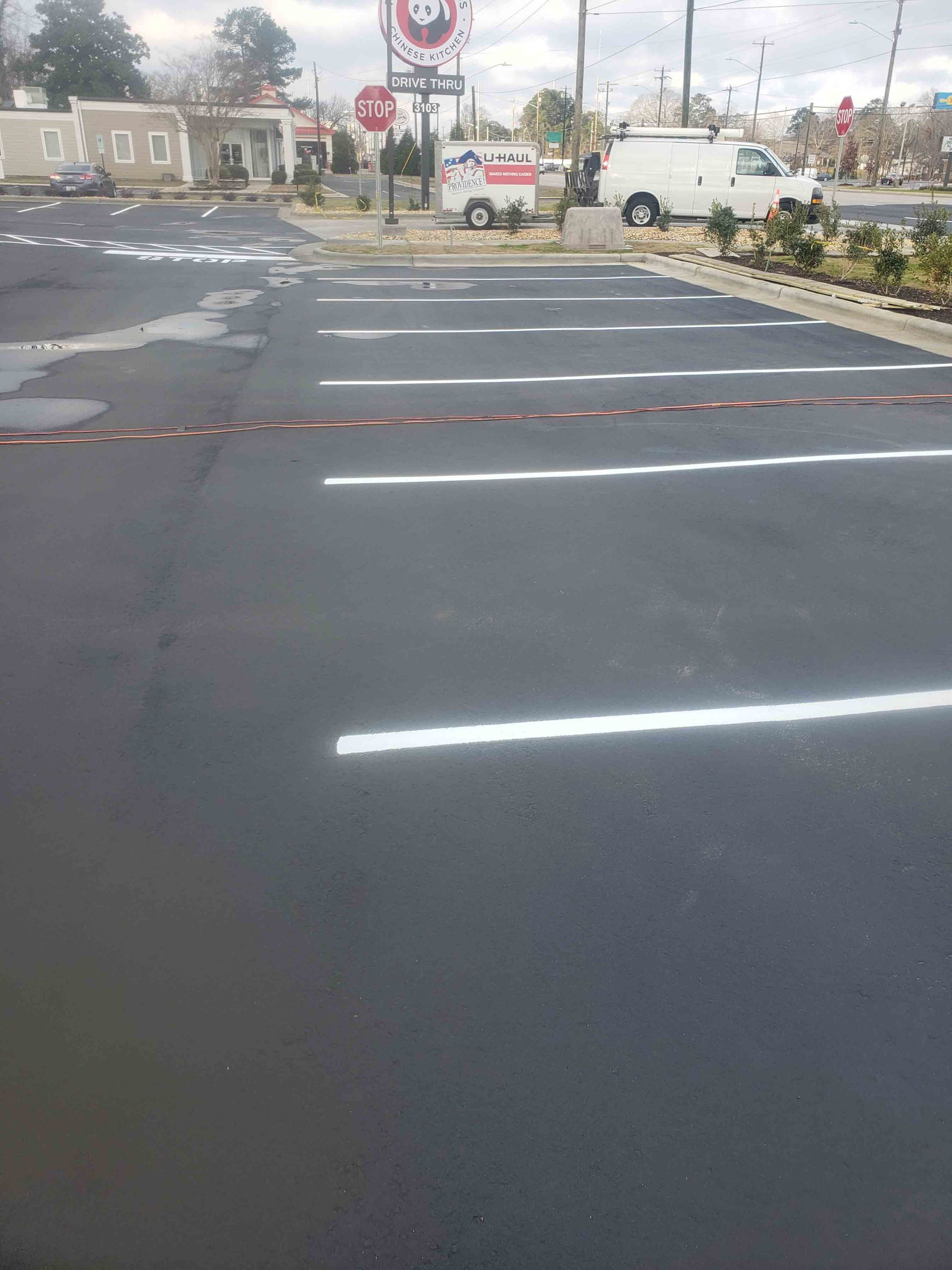 A parking lot with a lot of white lines on it.