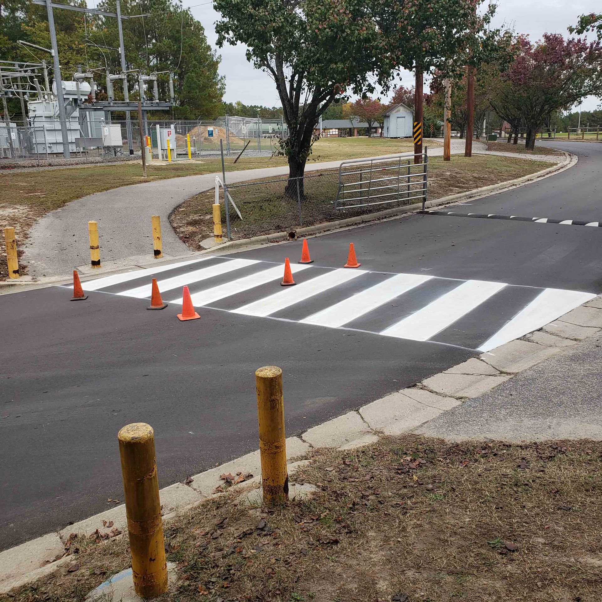 A crosswalk is painted on the side of the road