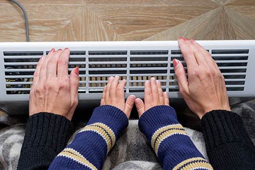 Mother and Kid Heating Hands — Rochester Hills, MI — Briarwood Heating & Cooling