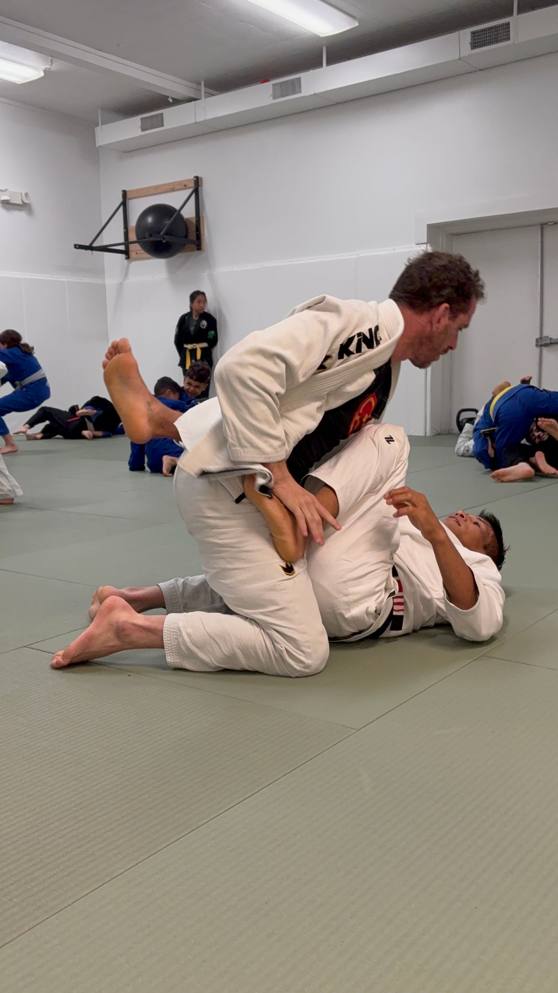 Students drilling Brazilian Jiu-Jitsu at Phoenix Brazilian Jiu-Jitsu and Martial Arts School.