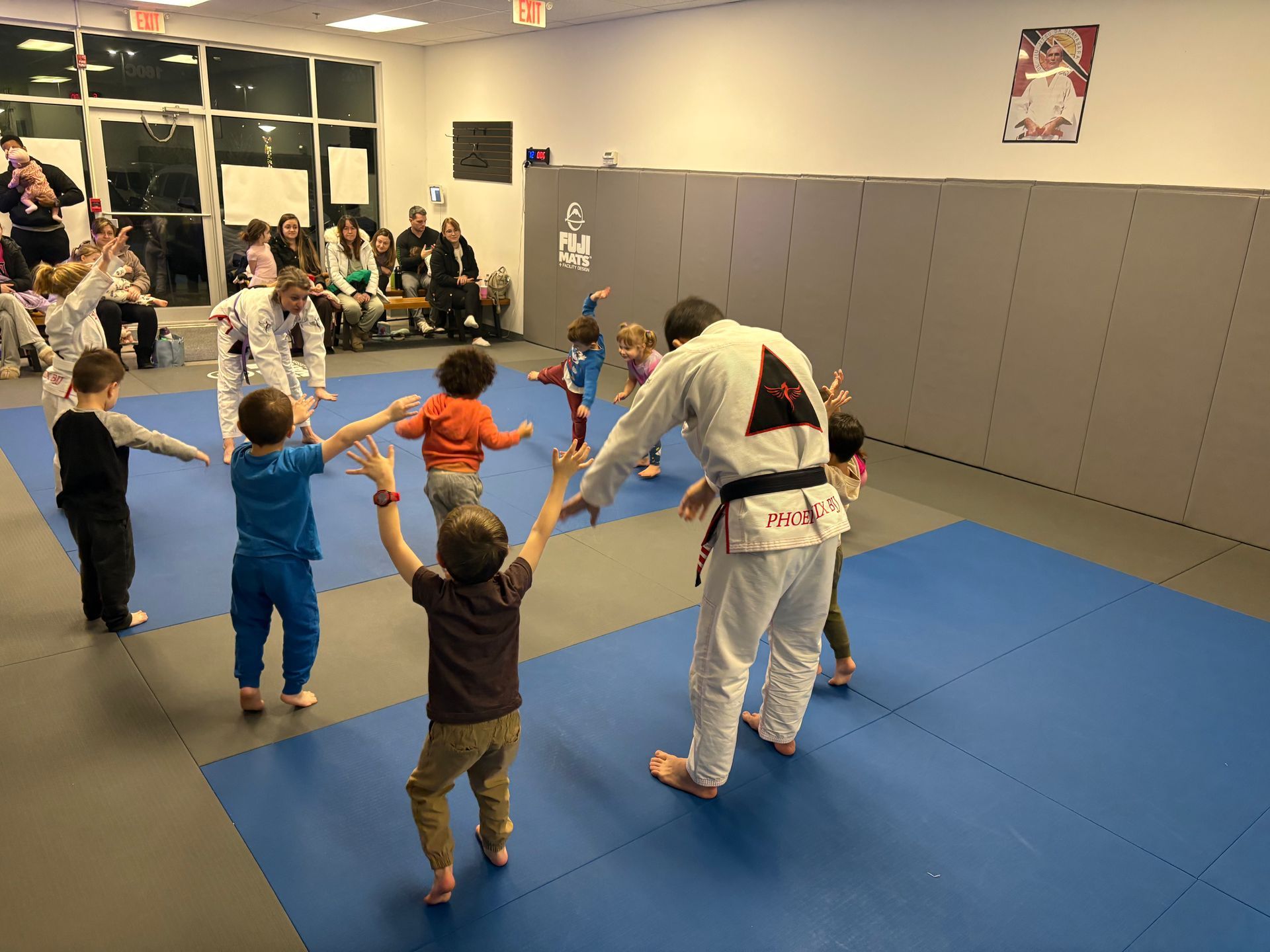 Family training Brazilian Jiu-Jitsu at Phoenix Brazilian Jiu-Jitsu and Martial Arts School in Marlborough, MA for fitness and bonding
