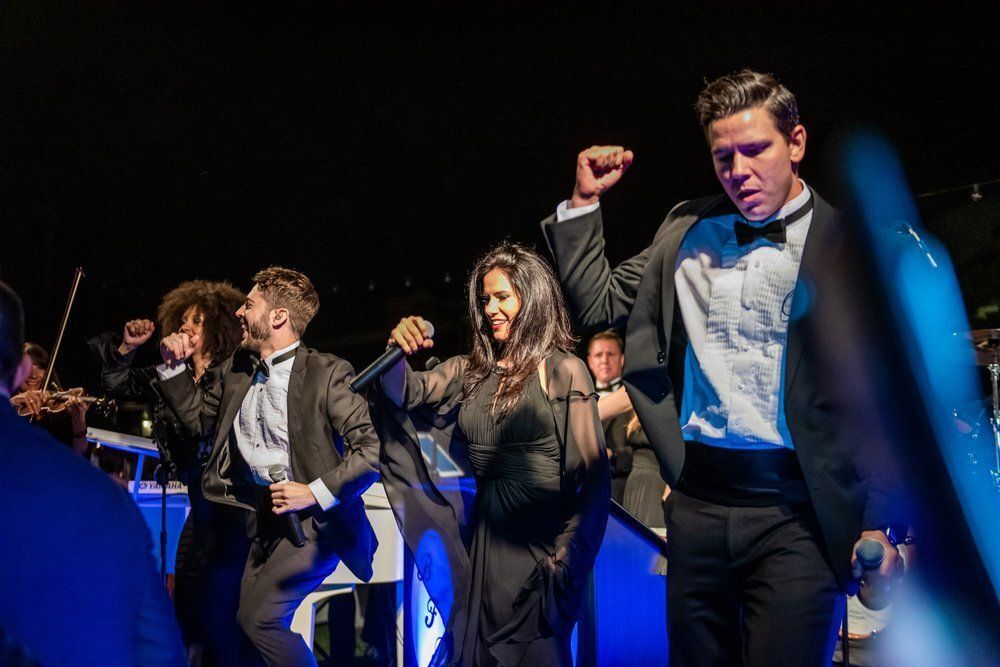 Live performers dance along with music at private event