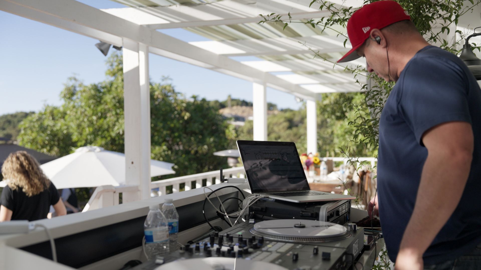 DJ set up on covered porch of farmhouse