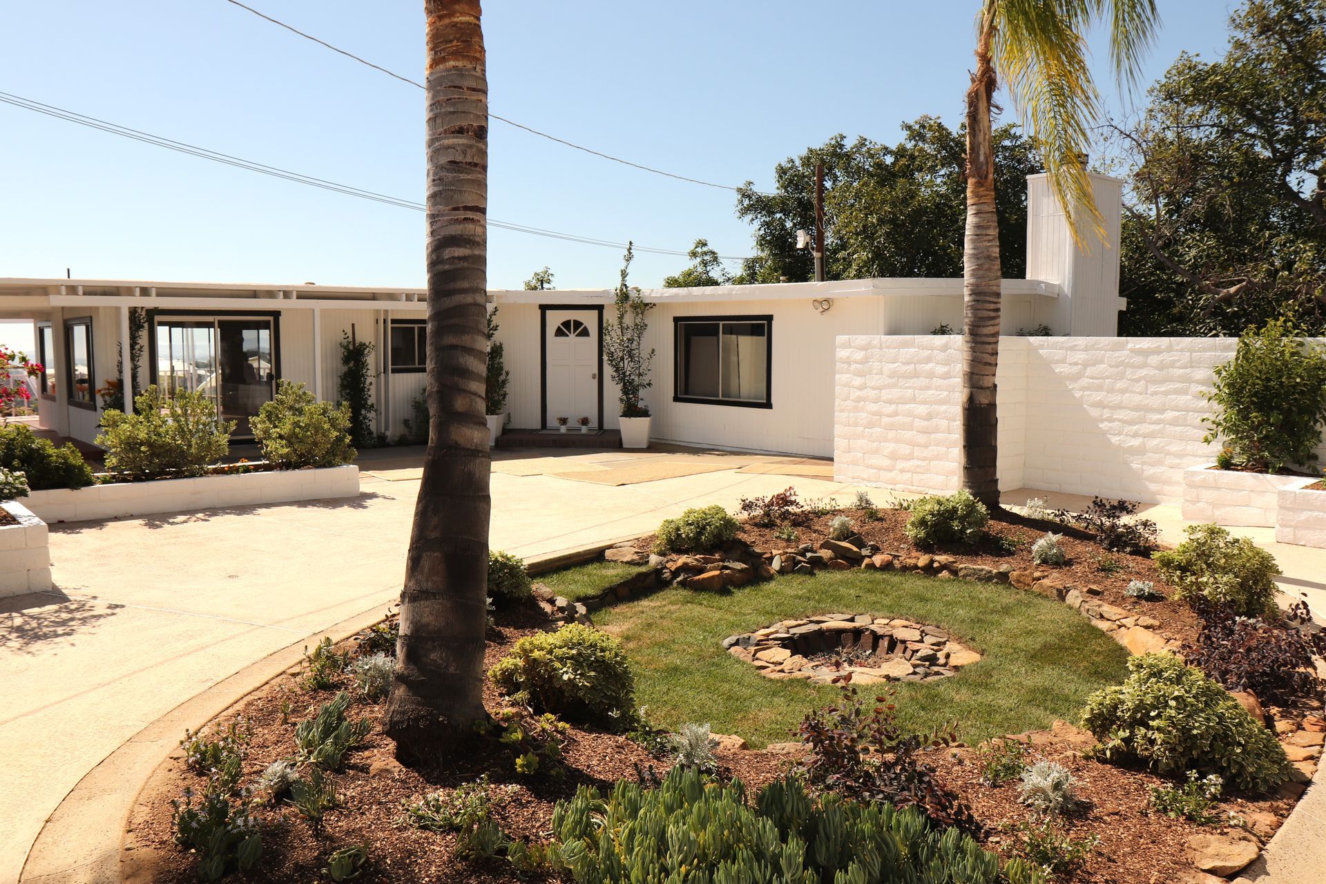 Front facade and driveway of Wild Acres farmhouse