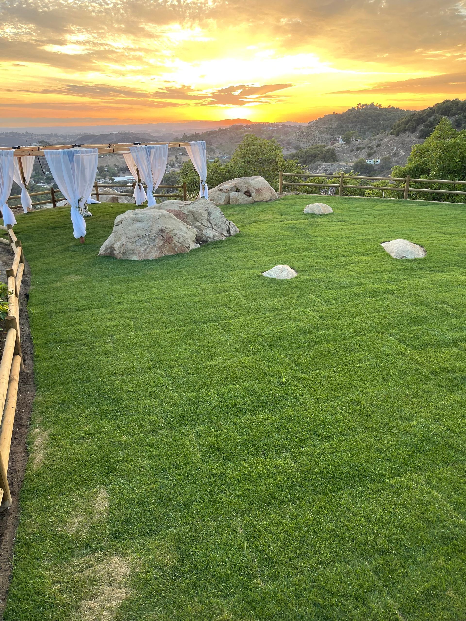 Backyard event venue space with fresh sod
