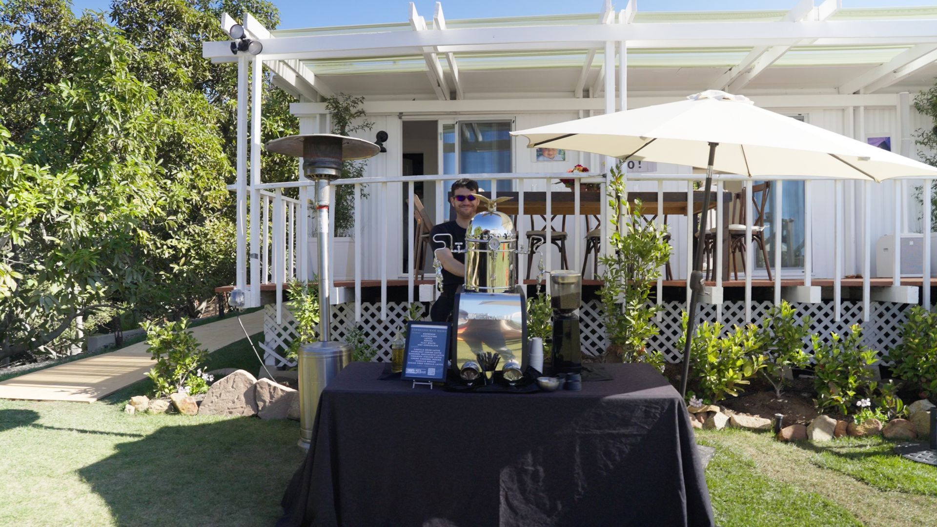 Custom coffee bar stand in front of wraparound porch