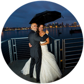 Danielle and paul evening waterfront wedding reception with umbrella