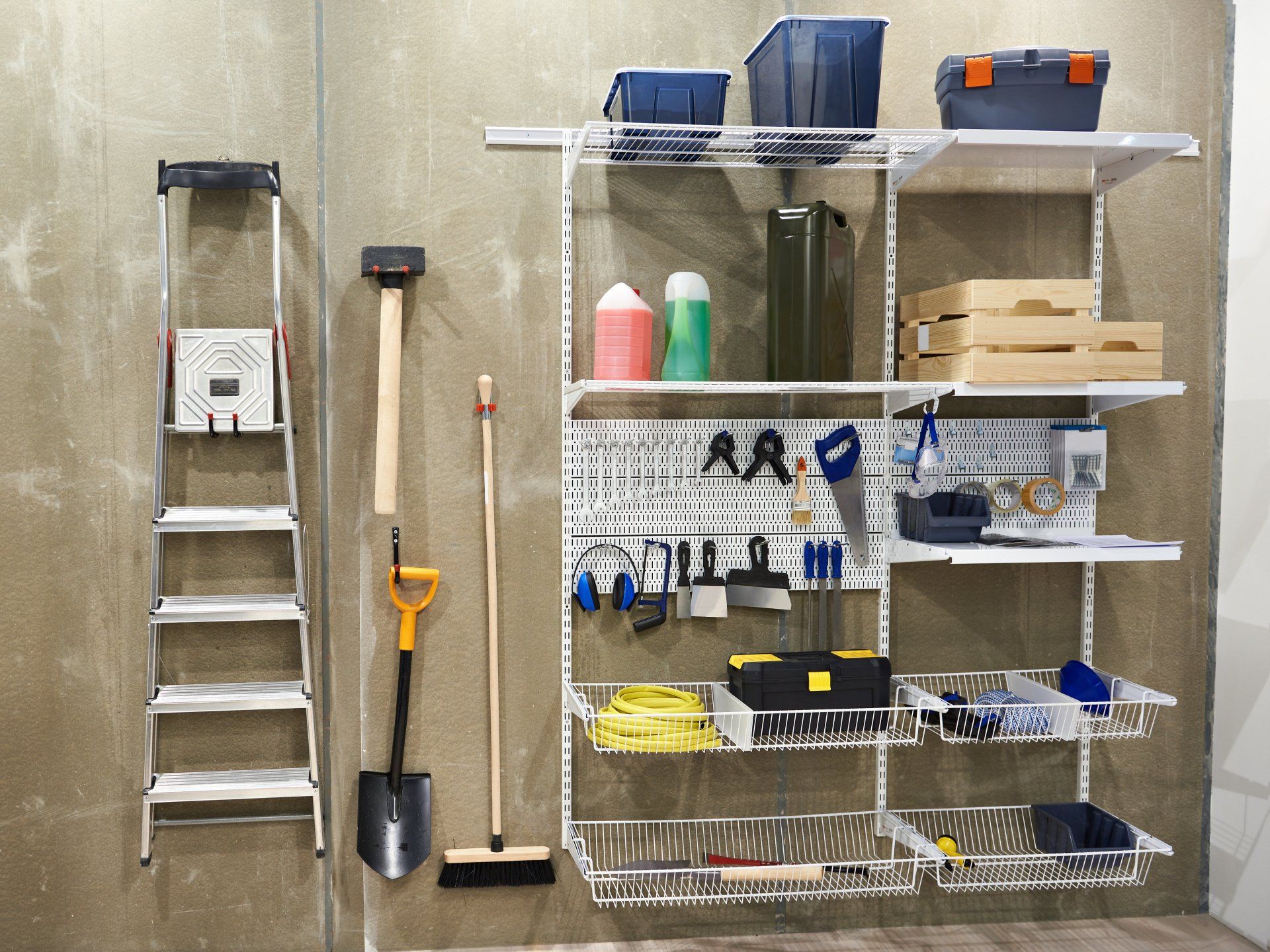 Organization racks on shed wall