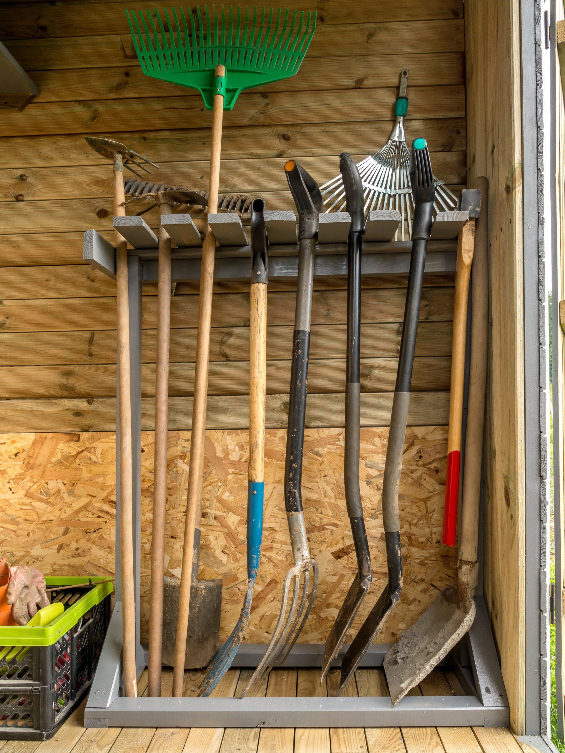 Gardening tools hanging inside a shed 