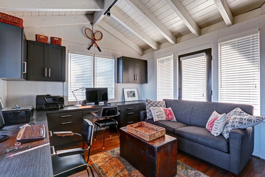 Nicely decorated portable shed converted to home office