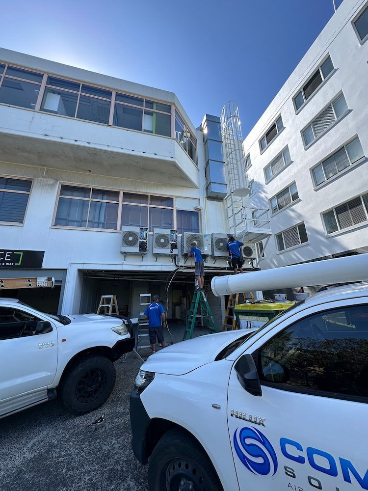 A White Truck is Parked in Front of a Building — Comfort Solutions in Buderim, QLD