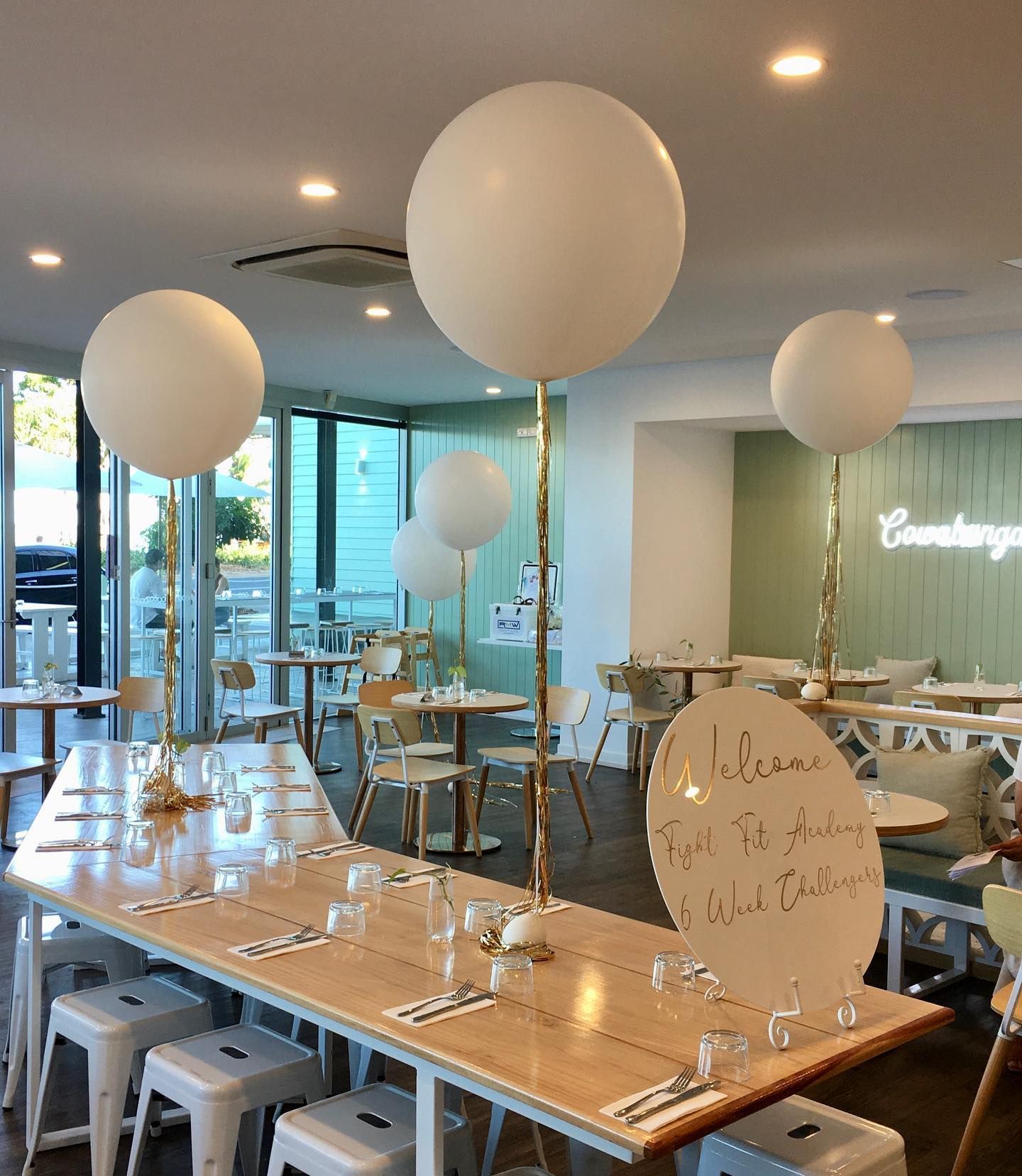 A Restaurant With Tables and Chairs and Balloons on the Tables - Yeppoon Balloons & Party Supplies in Yeppoon, Qld