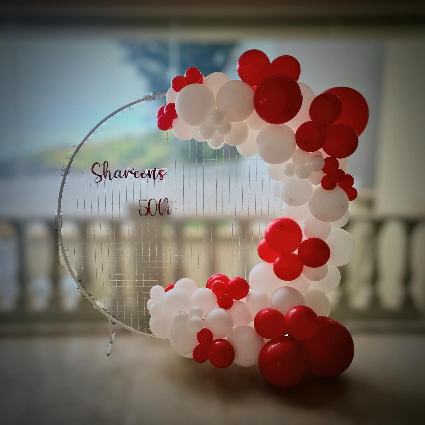 A Bunch of Red and White Balloons Are Sitting on a Table - Yeppoon Balloons & Party Supplies in Yeppoon, Qld