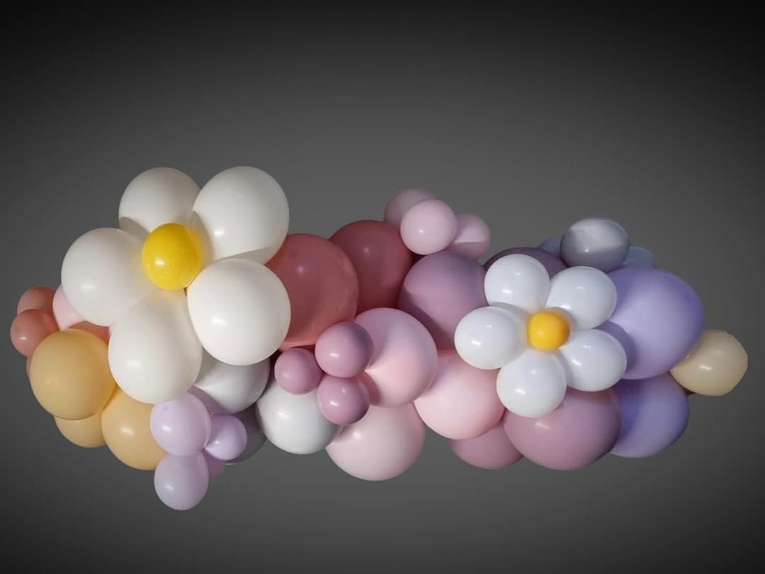 A Bunch of Balloons Shaped Like Flowers on a Gray Background - Yeppoon Balloons & Party Supplies in Yeppoon, Qld