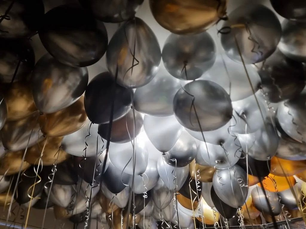 A ceiling filled with balloons