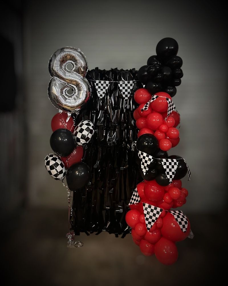 A Bunch of Red and Black Balloons Are Sitting on a Table - Yeppoon Balloons & Party Supplies in Yeppoon, Qld