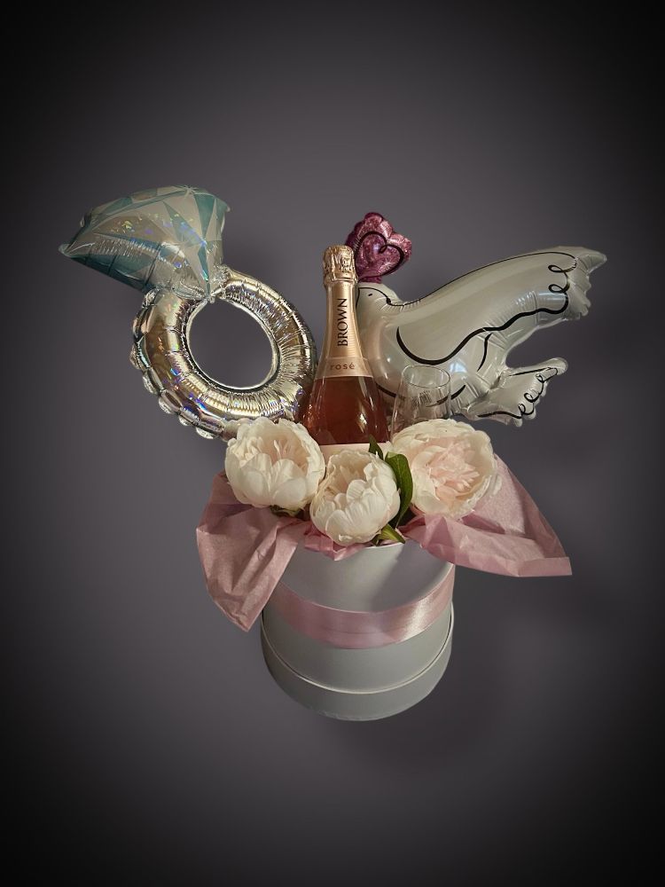 A gift box consisting of gifts and balloons