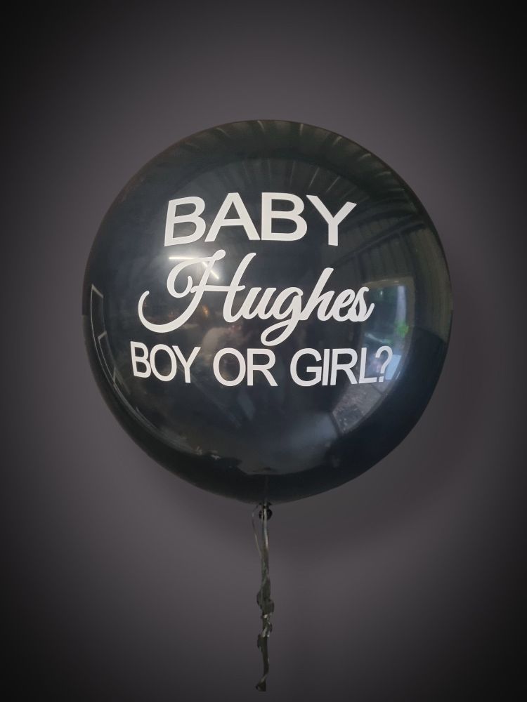 A personalised black balloon for a gender reveal
