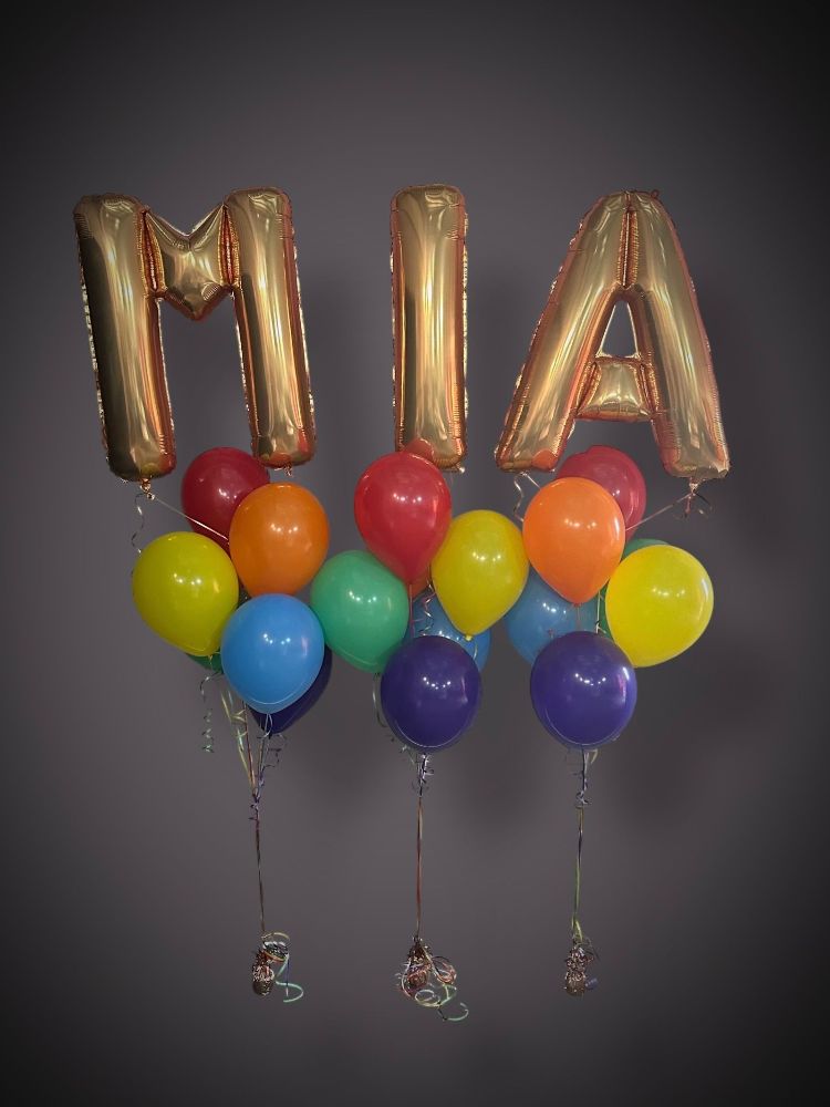 Number and letter foil balloons spelling MIA