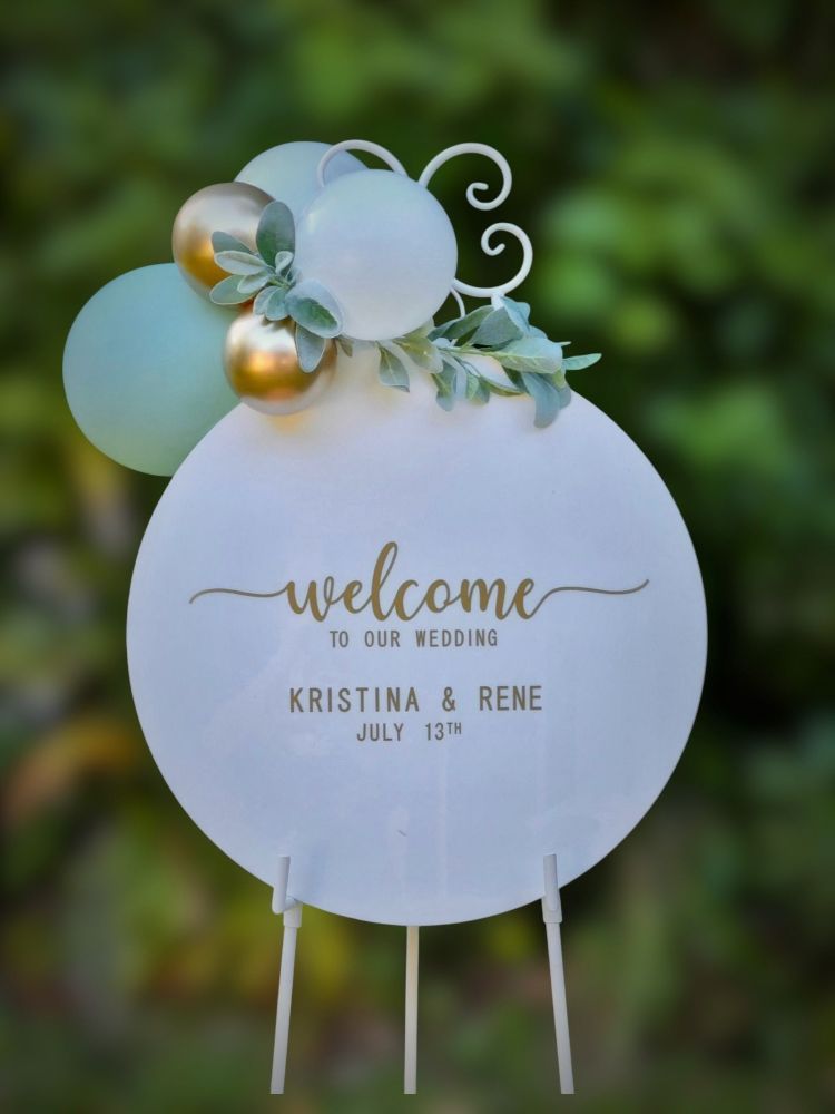 an Acrylic sign with balloons