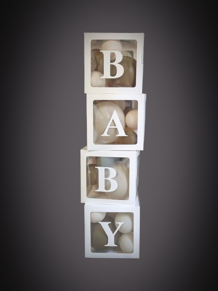 Boxes with balloons inside with letters on each box spelling BABY