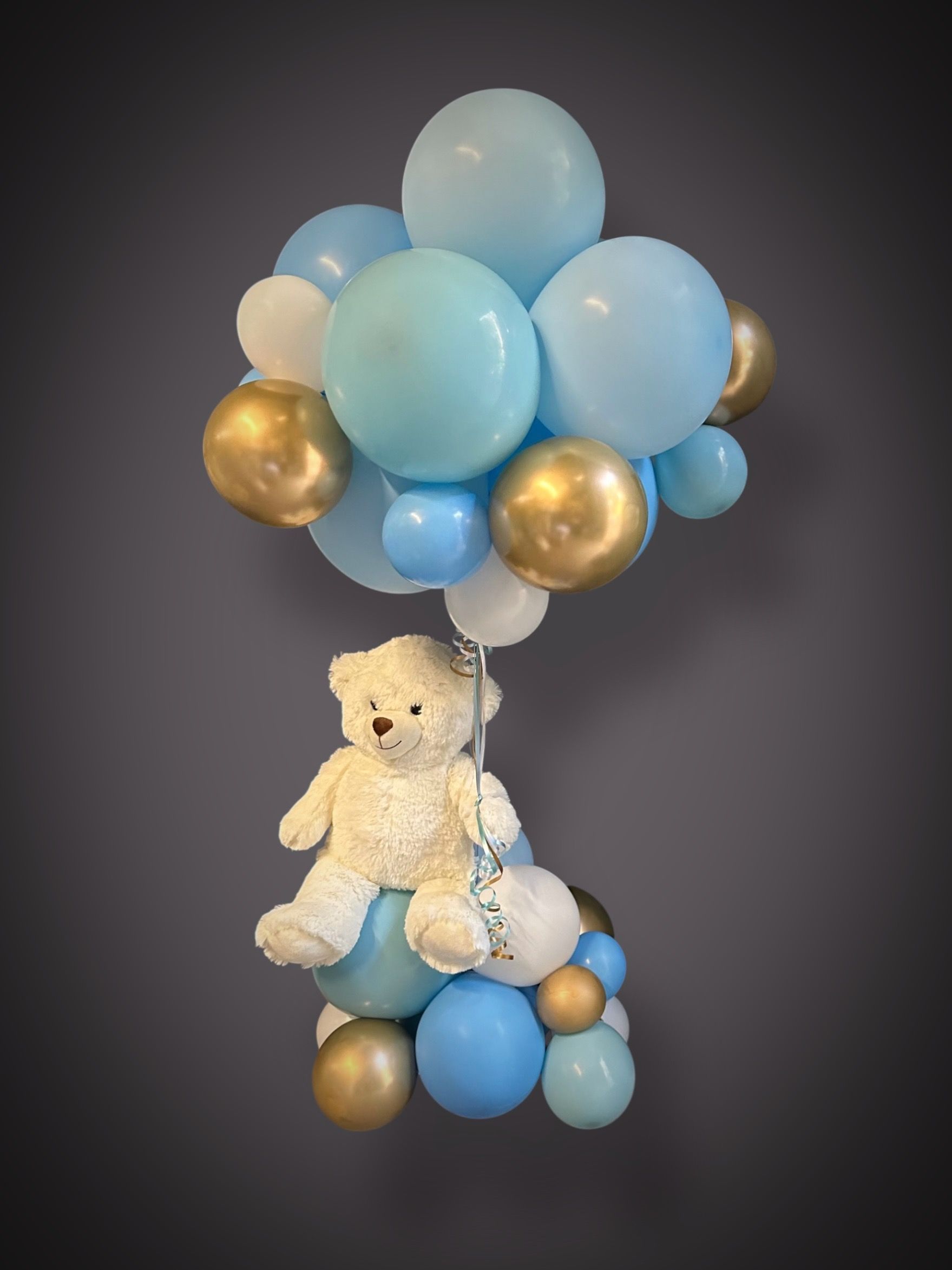 Balloon Airfilled centrepieces with a teddy bear in the middle