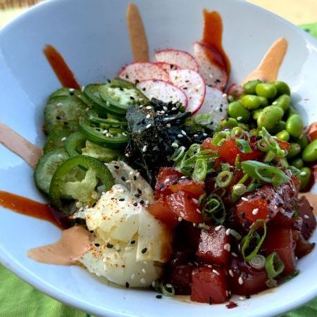 A white bowl filled with a variety of vegetables