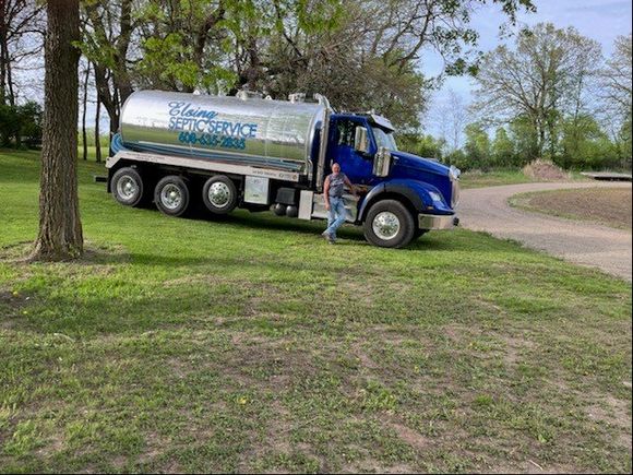 Owner Standing Next To Septic Truck — Poynette, WI — Elsing Septic Service