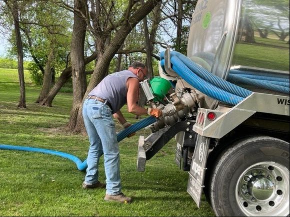Connecting Pipe On Truck — Poynette, WI — Elsing Septic Service