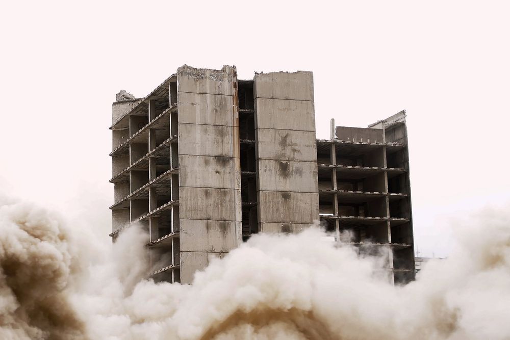 Blasting demolition of old building using controlled implosion with explosives