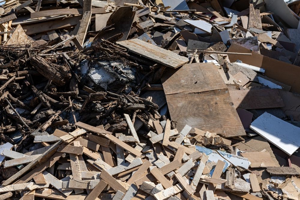 Debris management with pile of mixed construction debris, wood, and scrap materials ready for sorting and removal