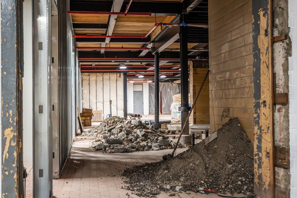 Interior Demolition and Renovation Site with Exposed Steel Structure and Construction Debris