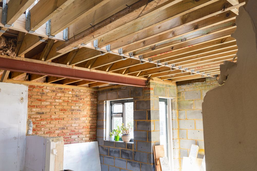 Selective demolition of the existing wall between the house and new extension. DIY renovation project, selective focus