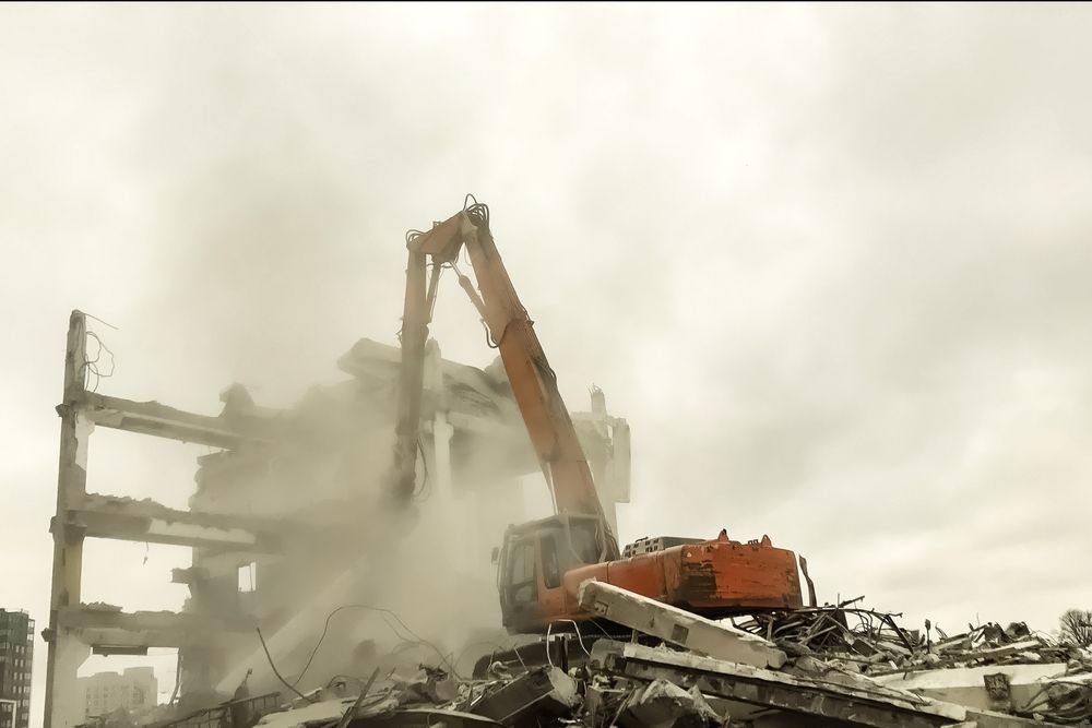 demolition dust in the air after demolition project