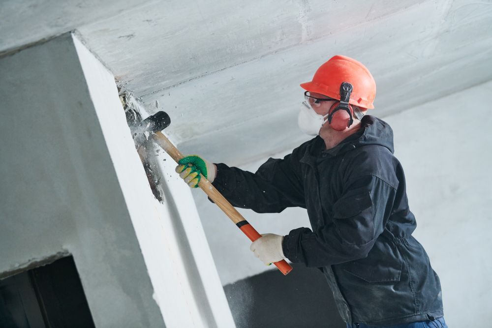 demolition worker doing an interior demolition project