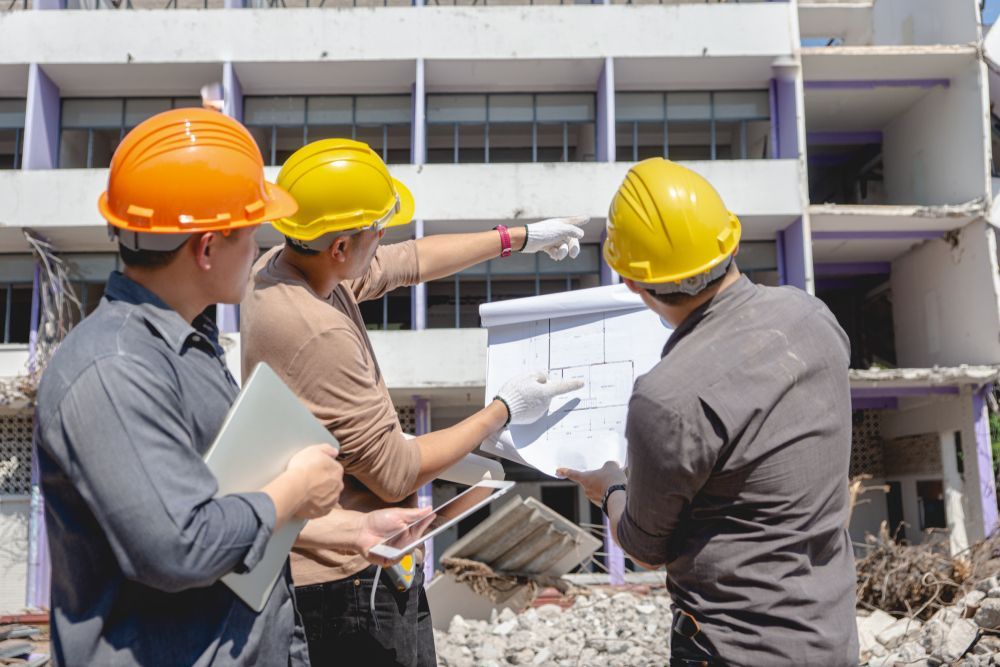 The engineering team is checking demolition plans.