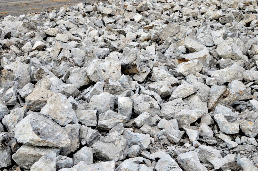 A pile of rocks is sitting on the ground.